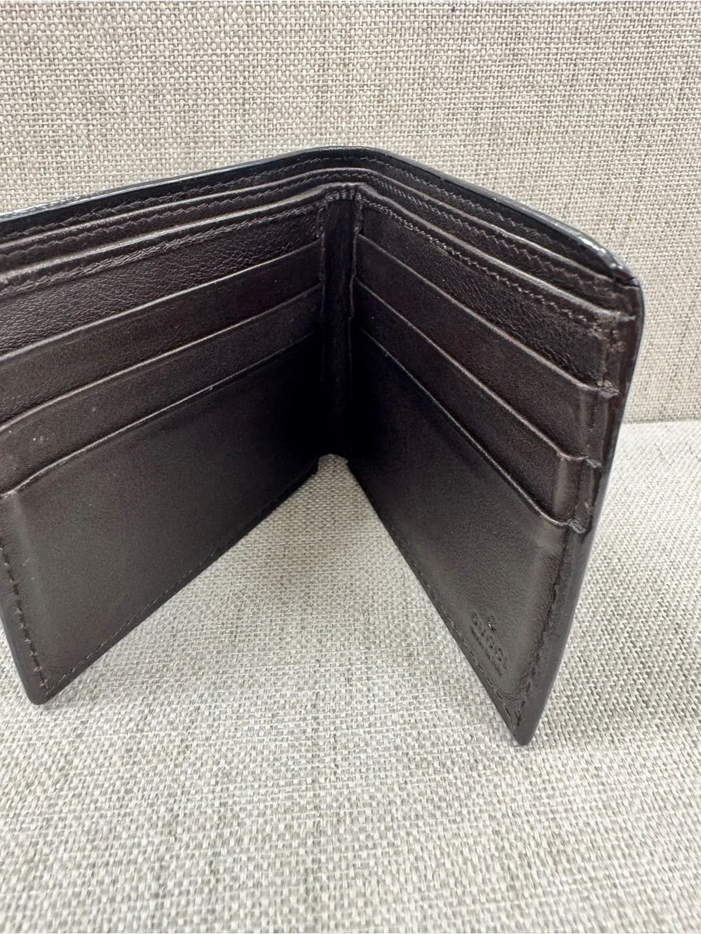 Gucci Dark Brown Embossed GG Leather Bifold Wallet